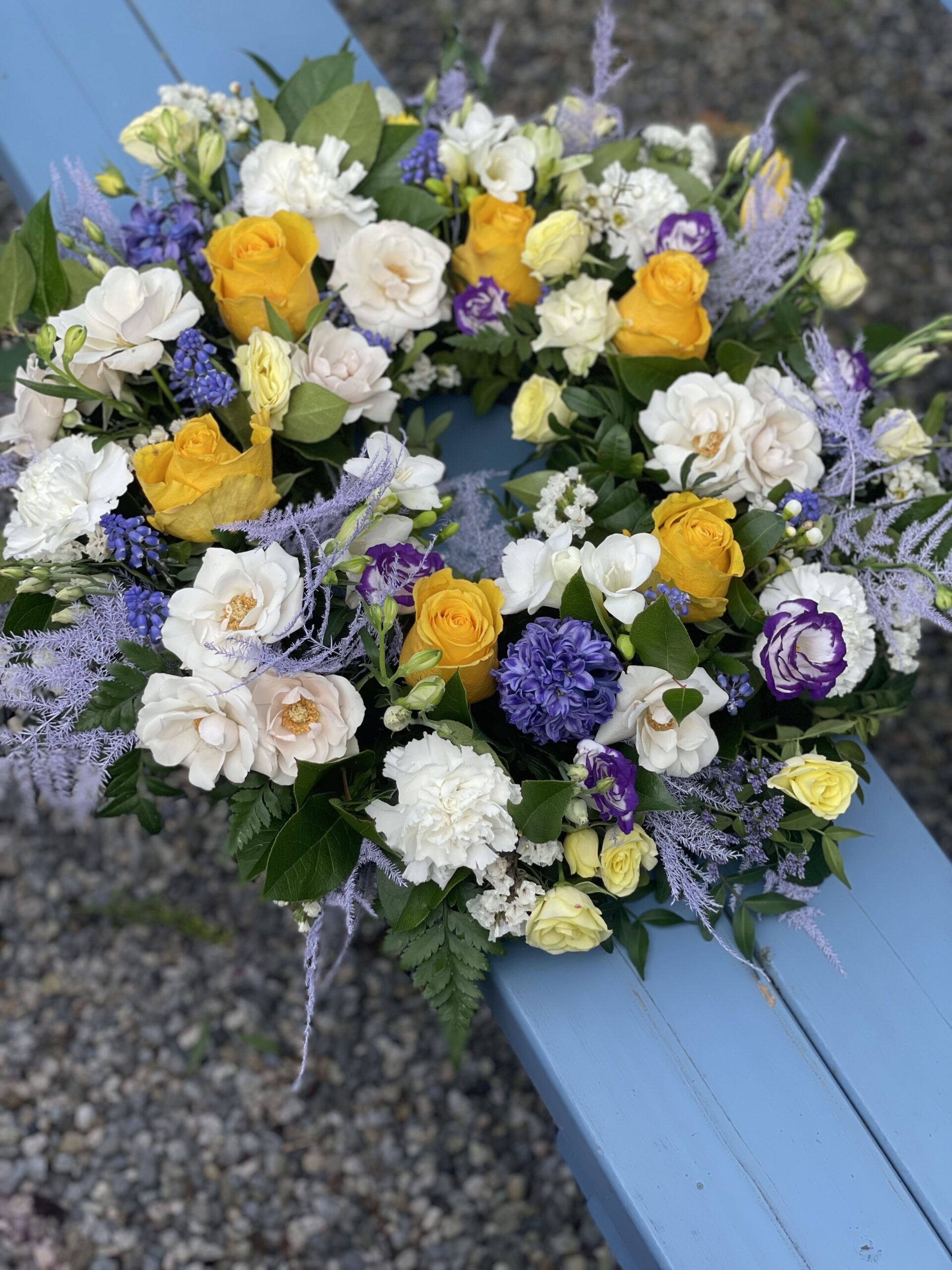 Yellow, white and purple wreath